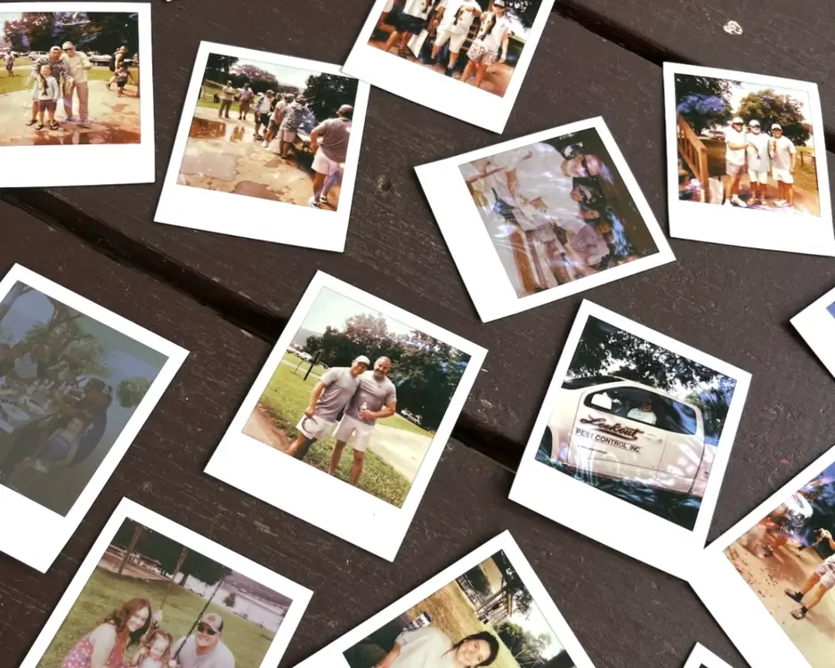 Several Polaroid pictures on a table of Lookout Pest Control memories
